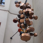 Pots and pans hanging outside a cafe